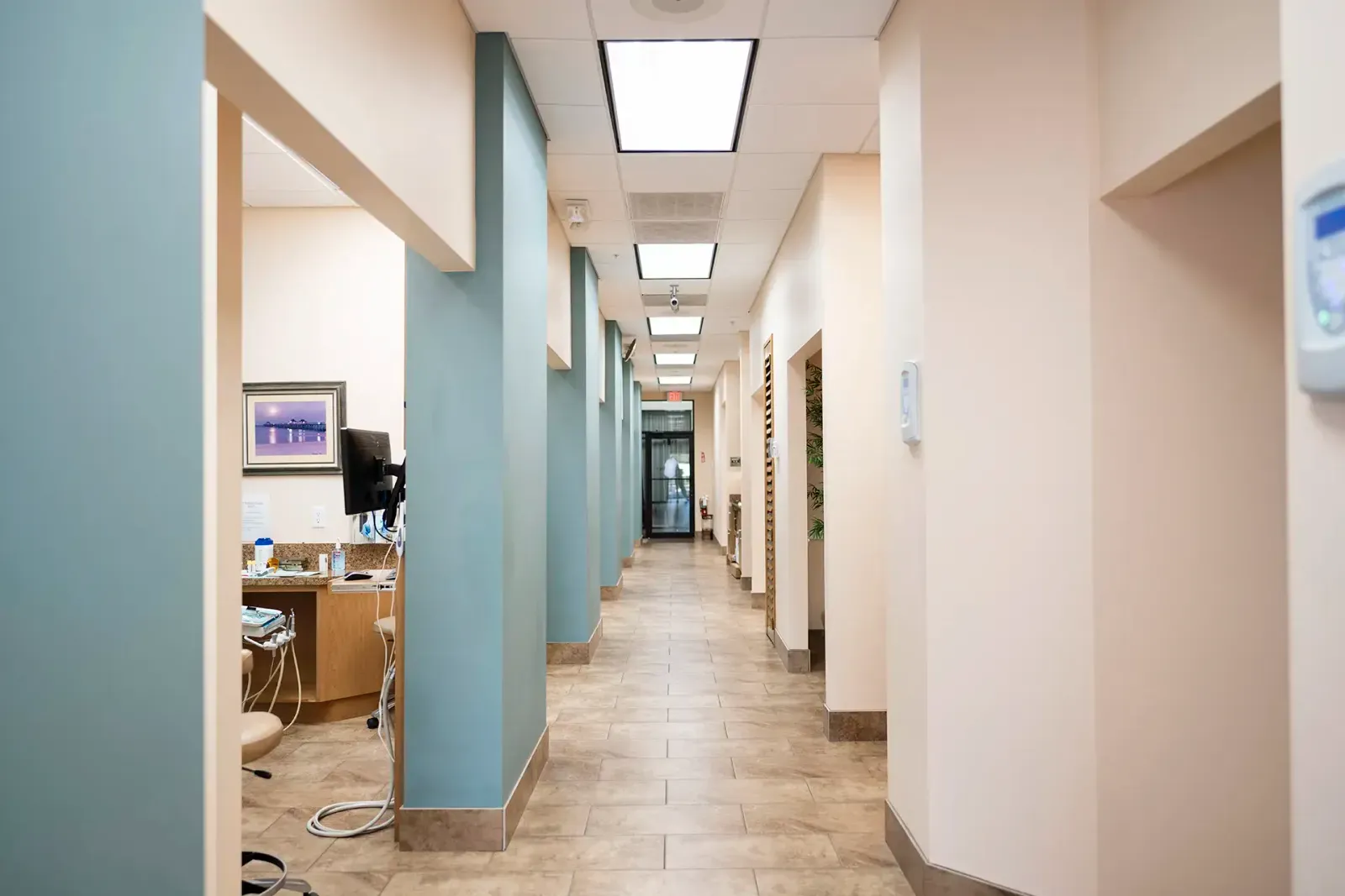Modern Dental Office Hallway – Suncoast Dental Center - suncoast dental center reviews Bright and clean hallway of Suncoast Dental Center, featuring open treatment areas and a welcoming, modern design for patient comfort - suncoast dental center reviews